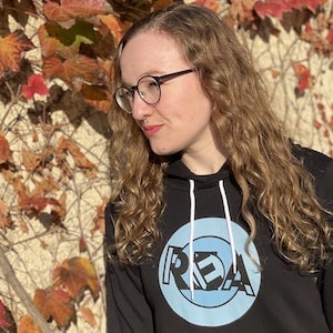 Lisa in the REA hoodie in Autumn