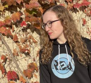 Lisa in the REA hoodie in Autumn