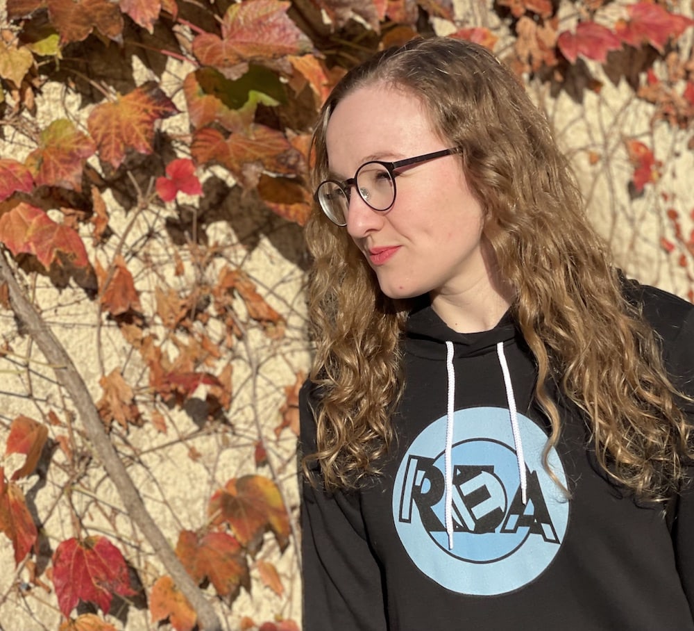 Lisa in the REA hoodie in Autumn