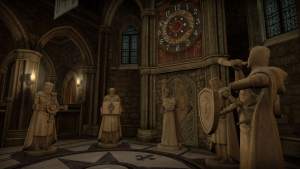 VR: a room in an imposing chapel with a large clock and several medival statues.