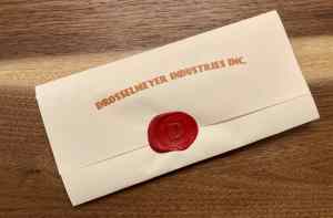 A wax sealed envelope from Drosselmeyer Industries Inc.