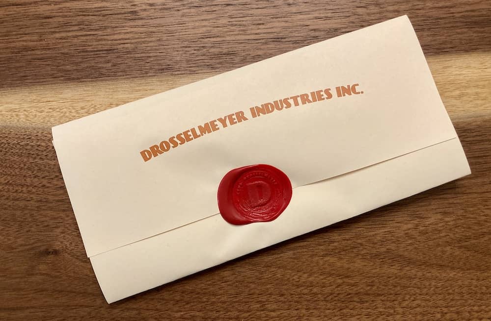 A wax sealed envelope from Drosselmeyer Industries Inc.