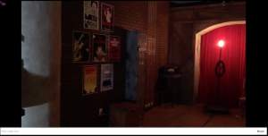 Backstage at the Haunted Theatre has posters and an illuminated ghost light.