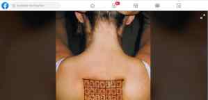 Image on Facebook of a woman from behind, a grid of numbers tattooed between her shoulder blades.