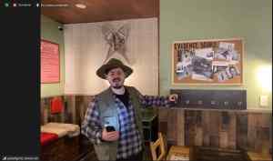 An outdoorsman with a sasquatch evidence board.