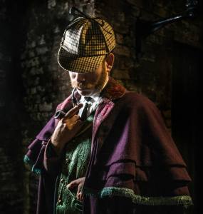 Sherlock Holmes smoking his pipe.