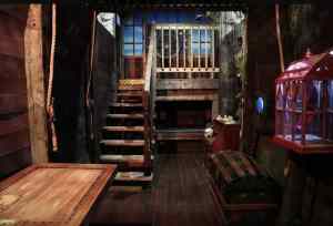 In-game: Interior of a pirate ship. A large chest sits in the middle.