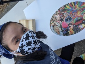 Tammy Selfie with the solved Guinness World Record oval jigsaw puzzle.