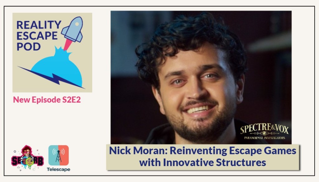 Man smiling with curly hair, short beard and grey eyes.