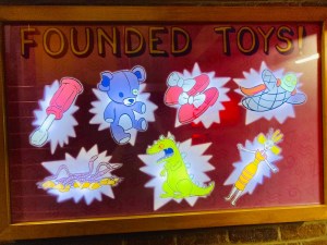 Illuminated scoreboard of "Founded Toys" all 7 are lit.