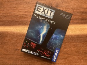 Exit The Game: The Stormy Flight box art depicts a cockpit view of a lightning storm.