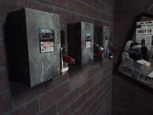4 electrical boxes, each locked with a padlock.