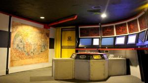An assortment of screens, controls, and maps in a submarine.