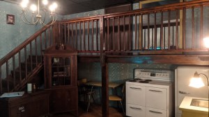 A 2 story set with an old kitchen.