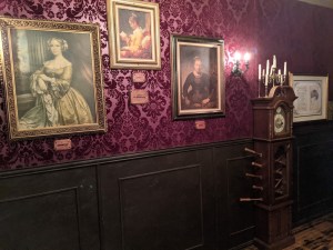 A grandfather clock that looks like it has been stabbed with sticks.