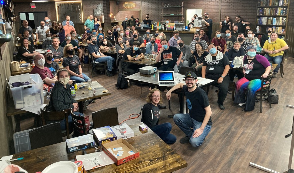 Group photo from the Montreal Tour shot in Escaparium Laval's board game cafe.