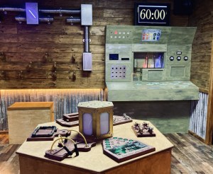 A wide view of the time machine, it has a wood and metal, old meets new aesthetic.