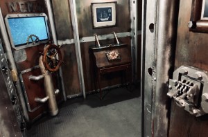 Wide view of a steampunk submarine interior. The walls are heavily weathered.