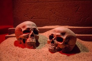 A pair of skulls in the sand pillar in an Egyptian tomb.