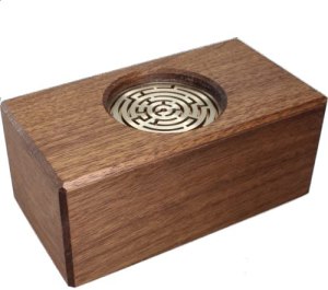 Wooden puzzle box with a metal maze embedded in the top.