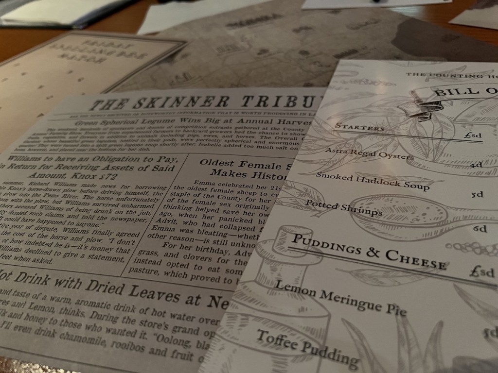 An assortment of puzzle components on the table includes, a map, a newspaper, and a restaurant menu.