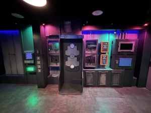 A wall of electronic equipment dramatically lit.