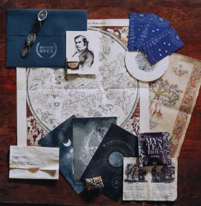 An assortment of maps, star charts, and other beautifully designed items.