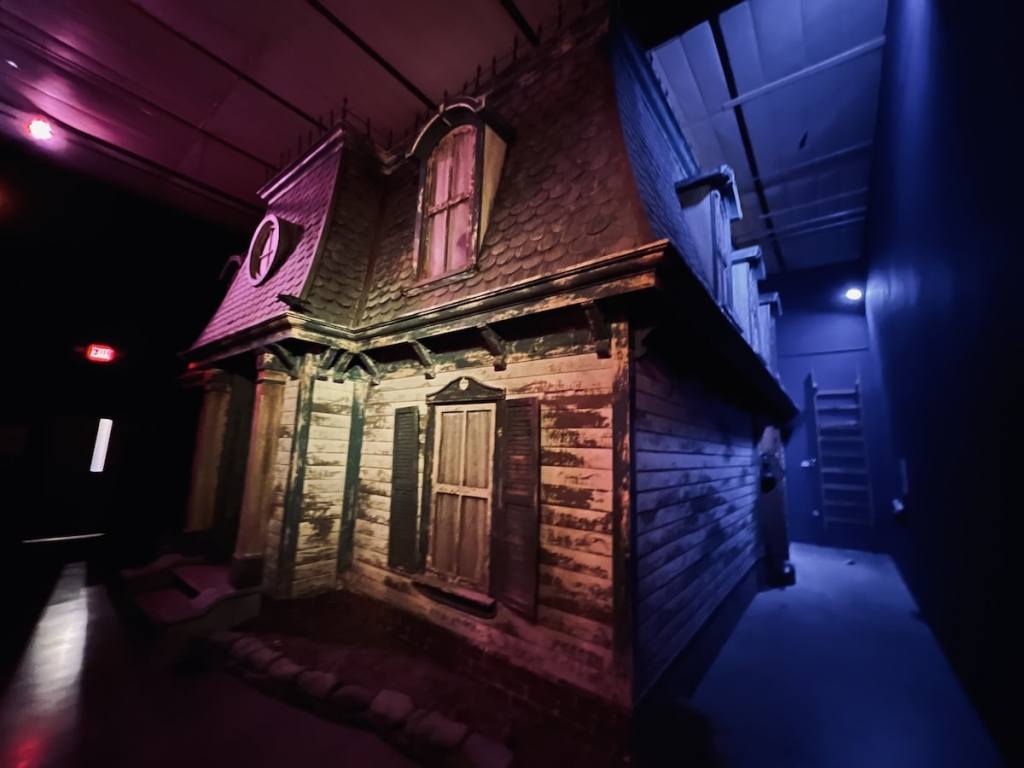 A massive haunted house exterior. The home is two stories, beautiful, and aged.