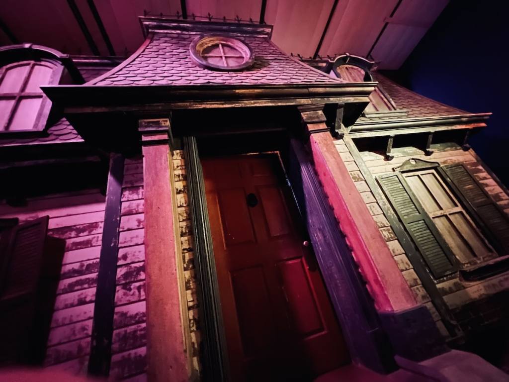 Exterior view of the front door of an old haunted house.