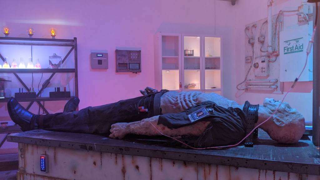 A zombie on a table in a lab.