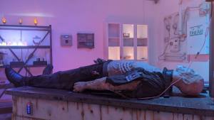 A zombie on a table in a lab.