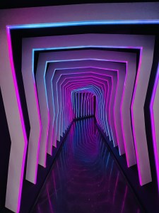 An elaborate tunnel glowing purple.