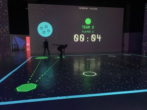 Someone running on a projected course.