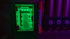 Closeup of Laffy Taffy beside a large glowing gummy bear.