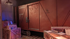 Crates beside a train car.