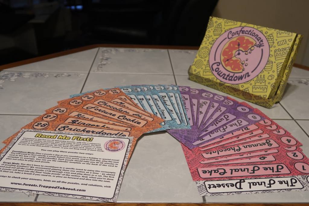 Confectionary Countdown box beside a set of 30 fanned out cards with dessert names.