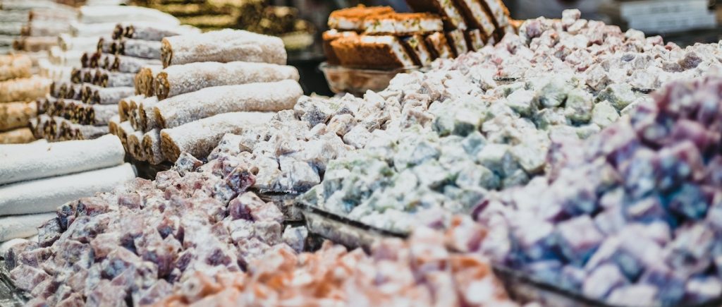 A large volume of Turkish delight on display in a market.