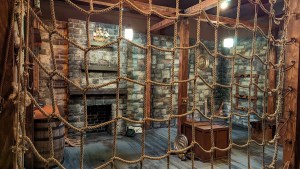 A pirate's den viewed through a cargo net.