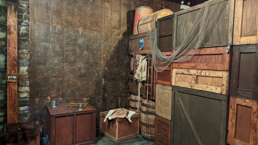 A collection of barrels and crates, stacked high.