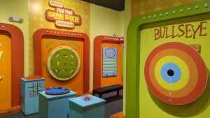 The Fun Time Game Show set is brightly colored and looks like a 1960s gameshow.