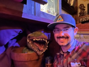 David taking a selfie with a venus flytrap puppet.