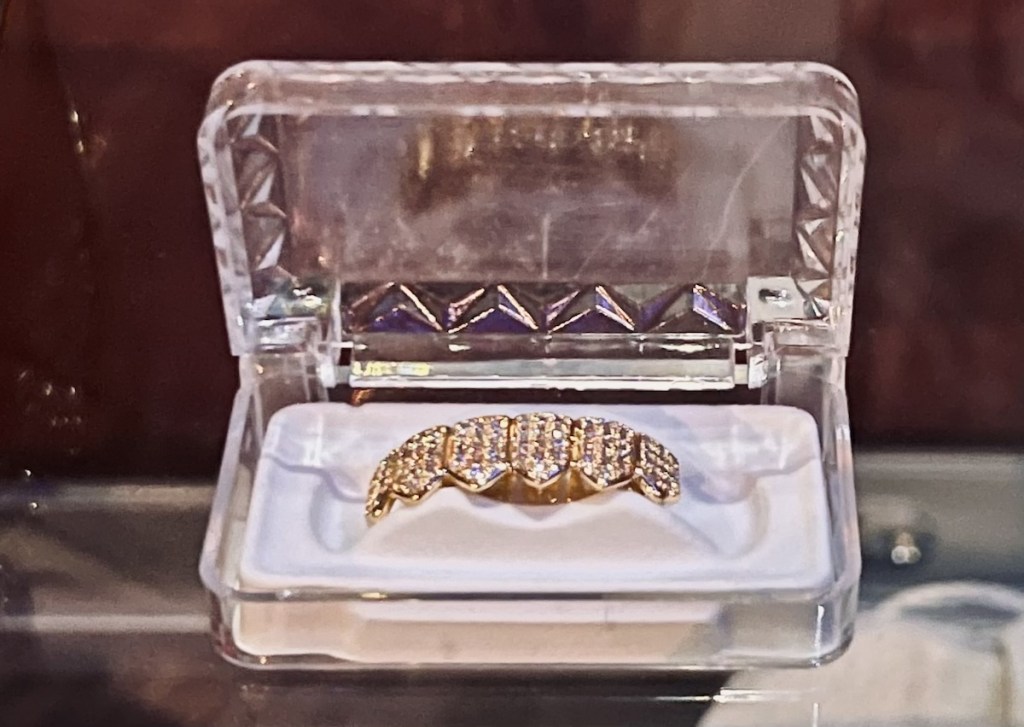 Closeup of a gold grill.