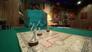 A table in an 80s basement with a tabletop RPG setup.