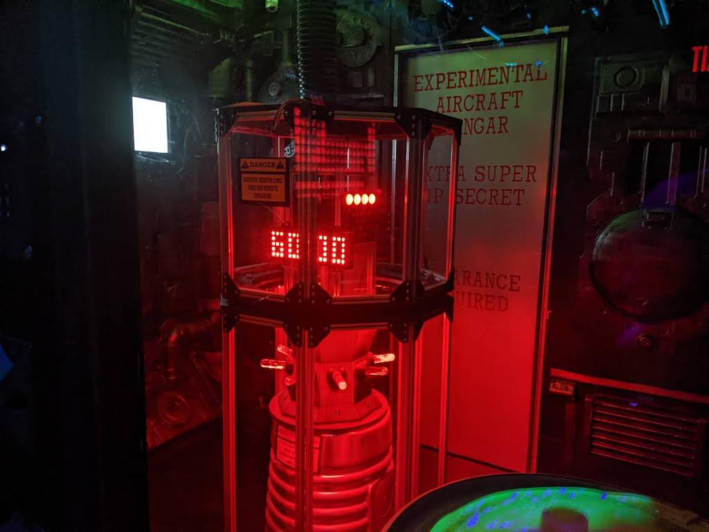 A large red futuristic bomb with a. 60 minute countdown timer.