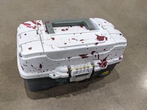 Closeup of a bloodied tacklebox.