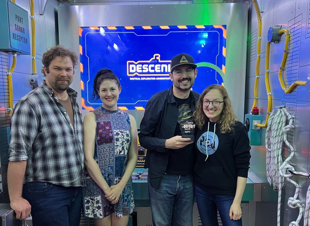 Andrew, Madeleine, David, & Lisa posing after having competed The Depths.