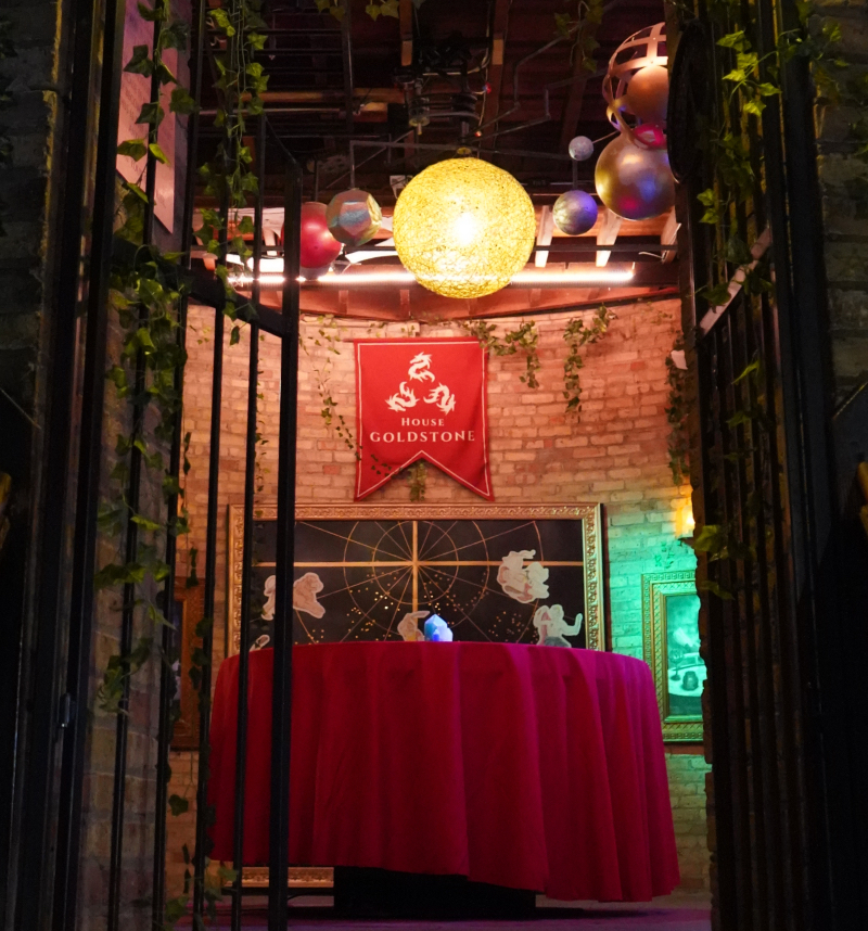 The open gate to a tower, inside is a wizard's laboratory.