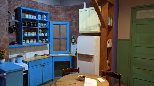 A an old kitchen in an apartment.