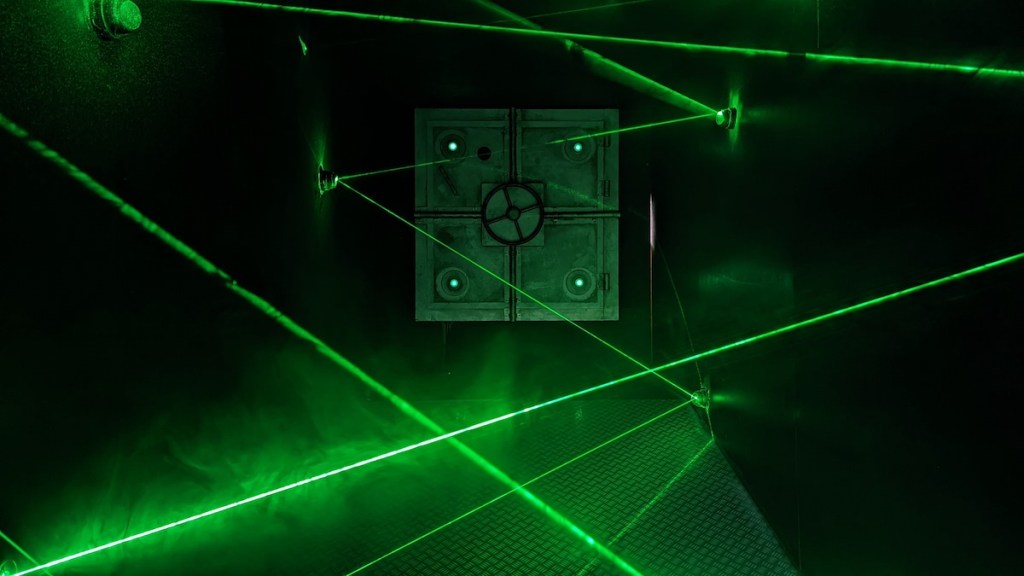 A laser maze in a long, dark, narrow room.