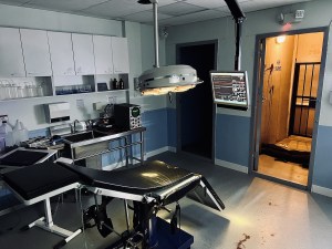 A lab for human study, there is an assortment of equipment, but it looks in disarray, there is blood spatter on the fllor.